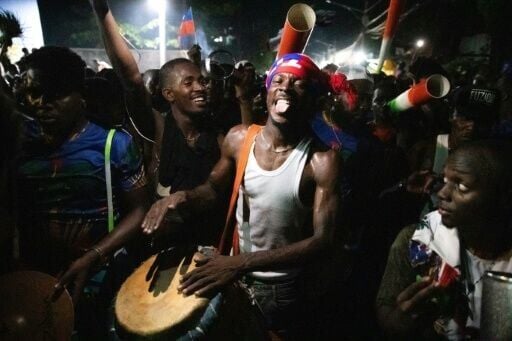 Fans celebrate in the streets of Port-au-Prince after Haiti's football team beat Nicaragua to qualify for the 2026 FIFA World Cup