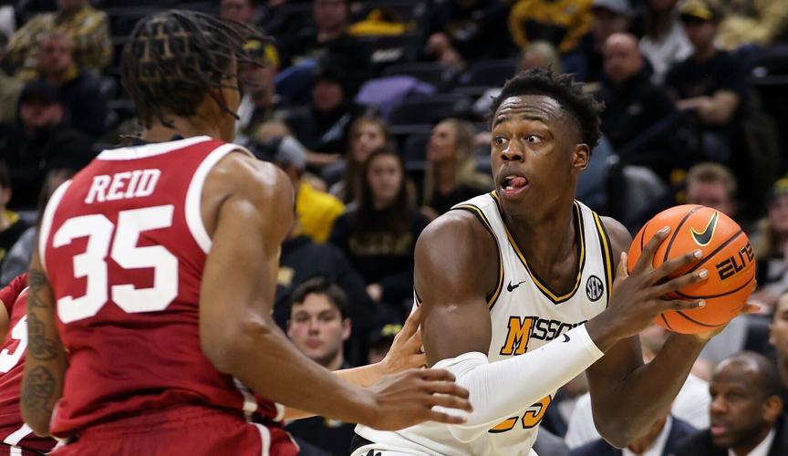 Missouri guard Mark Mitchell looks for a teammate (copy)