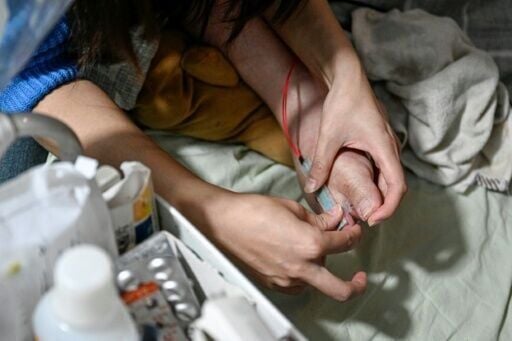 Li uses the one finger he can move to manipulate a trackball controlling an on-screen cursor, and uses a flex sensor attached to his toe to click