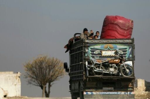 Syrian rebels surround Hama 'from three sides', monitor says