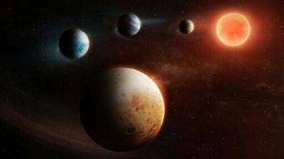 This artist's impressions shows the unusual set up of the solar system around the LHS 1903 star