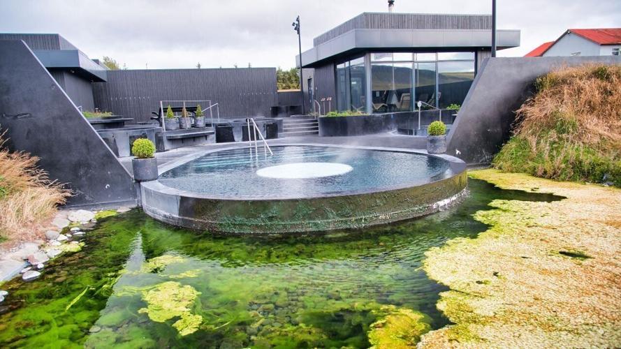 KRAUMA, ICELAND – AUGUST 10, 2019: Famous Krauna spa center in Western Iceland with thermal pools.