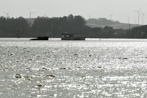 A building is surrounded by floodwaters at Las Pachecas settlement in Jerez, southern Spain