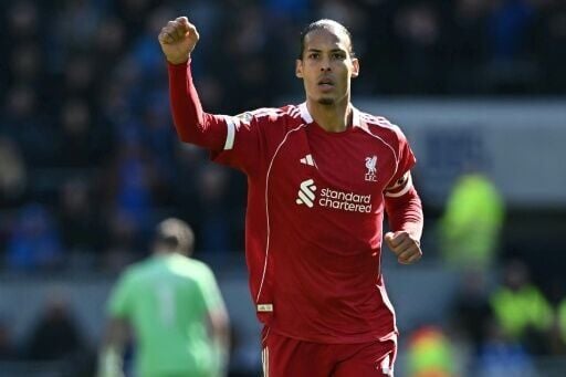 Liverpool captain Virgil van Dijk celebrates his team's winning goal against Everton