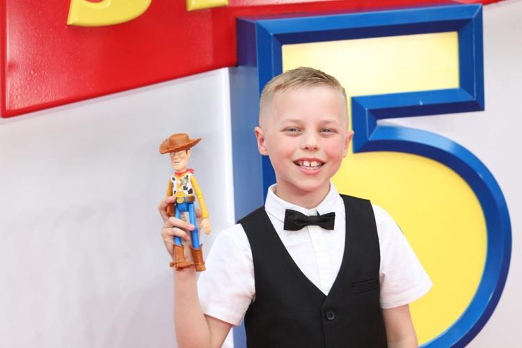 Toy Story fan meets stars when Disney track him down 6yrs after viral photo