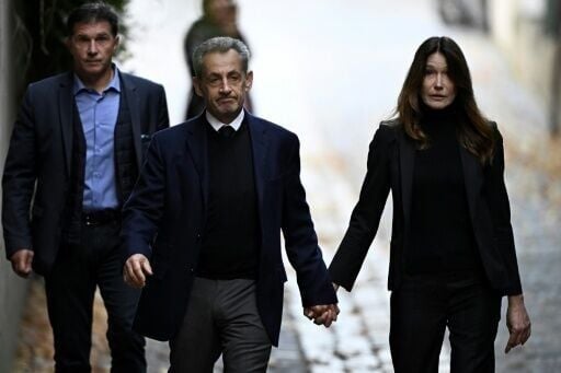 Sarkozy (left) said his time in prison was tough