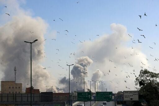A plume of smoke rises after a strike on Tehran