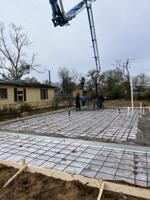 Foundation poured for first tornado-destroyed home  rebuilt with financing from United Way Disaster Fund