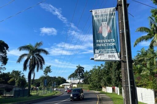 An HIV awareness poster displayed along a main road in Suva
