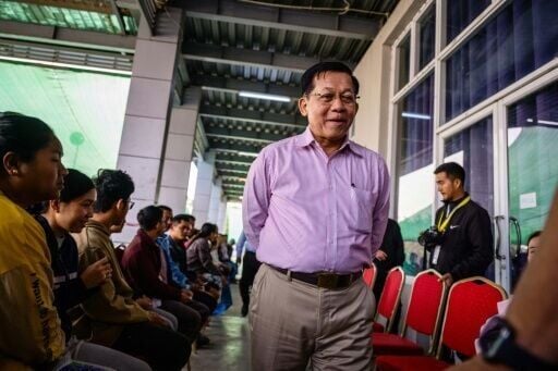 Military chief Min Aung Hlaing visits a polling station during the third and final phase of Myanmar's general election in Mandalay on January 25. The decision by the top brass to cloak its command in civilian dress means ceding some of the junta chief's...