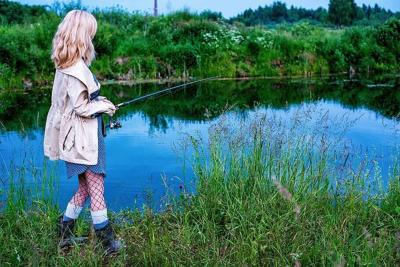 Girl fishing stock
