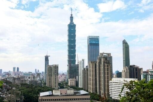 The Taipei 101 building is seen among residential and commercial buildings in Taipei in December 2025. Beijing on Monday announced major live-fire drills around the island