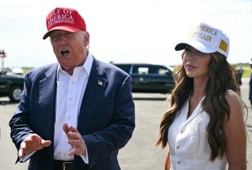 US Secretary of Homeland Security Kristi Noem accompanies President Donald Trump during a visit to a detention center in the Florida Everglades