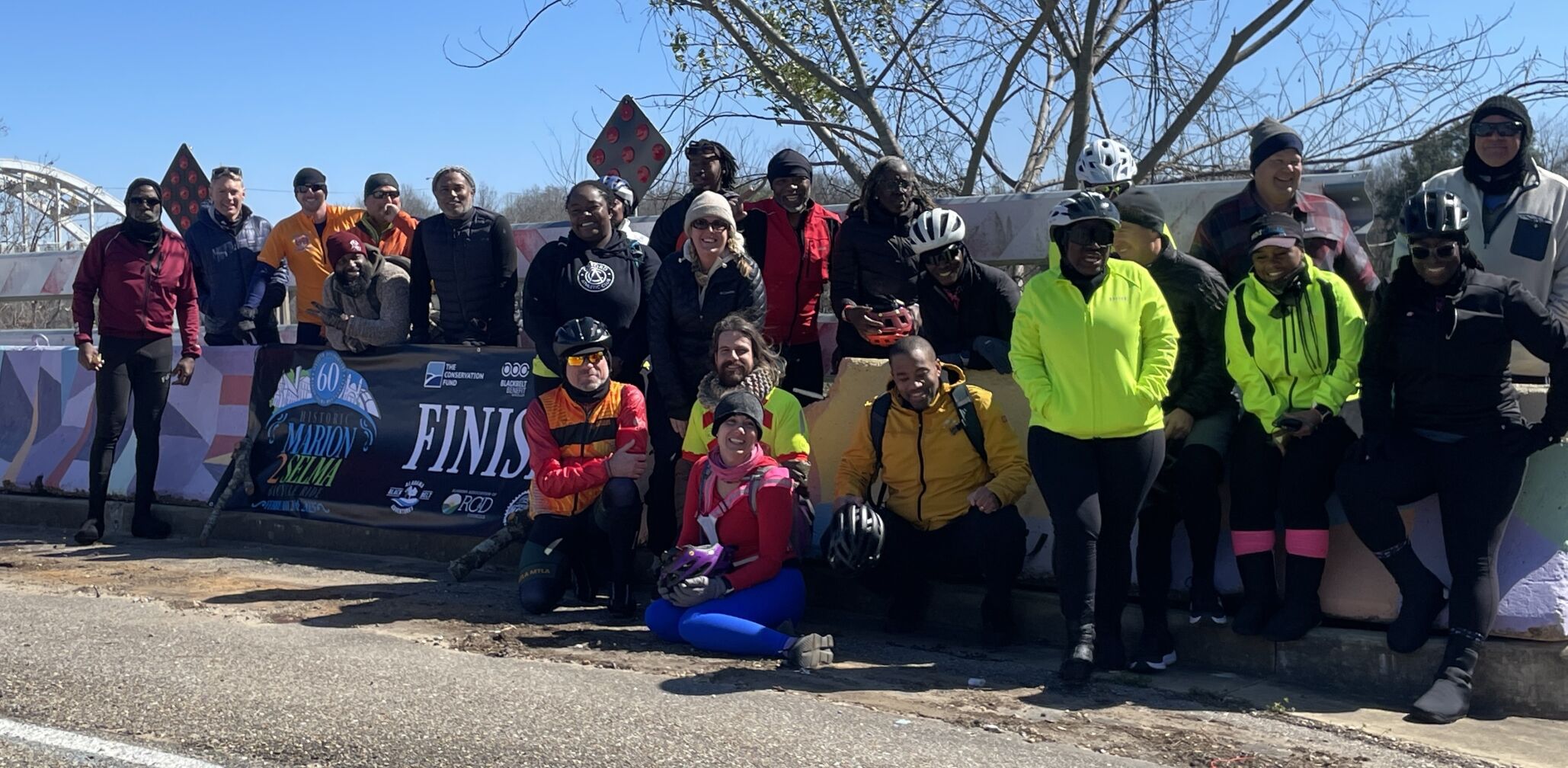 Cyclists gather at the official finish line for the first ever Marion to Selma Bike ride