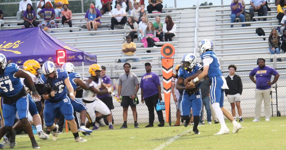 Demopolis ball quarterback to running back.JPG