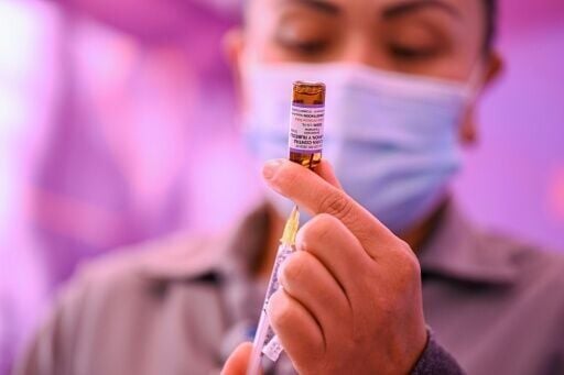 A healthcare worker prepares a dose of the measles vaccine as part of a campaign in Mexico City