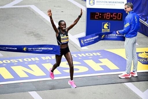 Kenya's Sharon Lokedi celebrates defending her Boston Marathon title