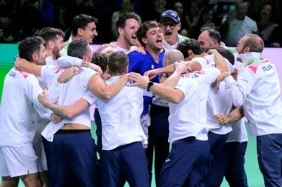 Flavio Cobolli (C) is mobbed by his team-mates after sealing another Davis Cup triumph for Italy