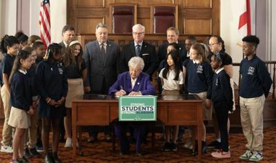 Kay Ivey signing education legislation