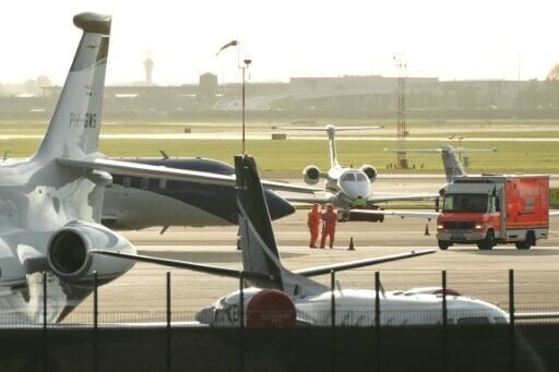Medical personnel in hazmat suits met the aircraft thought to be carrying passengers from the cruise ship
