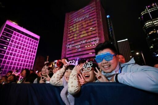 People watch live performances and a light show during New Year’s Day celebrations in Hong Kong