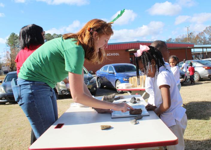 Rachel helps child.JPG