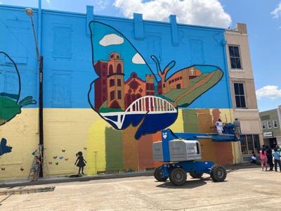 Over 200 students paint mural depicting history of Selma on Welcome Center wall