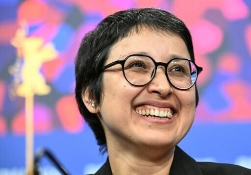 Afghan director and actress Shahrbanoo Sadat laughs as she attends a press conference for the film "No Good Men" presented in Berlinale Special Gala at the 76th Berlinale.