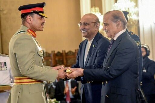 Asim Munir, left, receiving his field marshal baton from President Asif Ali Zardari, centre, and Prime Minister Shehbaz Sharif in May