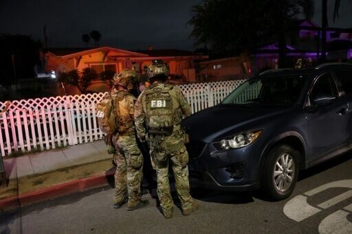 An FBI tactical team prepares to enter a house associated with the suspected White House Correspondents' Dinner shooter in Torrance, California, on April 25, 2026