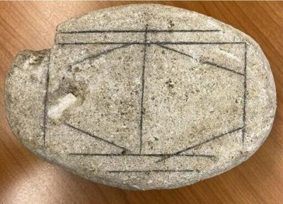 This handout picture shows a smooth, white stone dating from the Roman era in Het Romeins Museum, Heerlen that has long baffled researchers