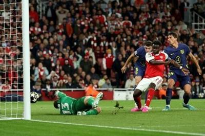 Arsenal's Bukayo Saka scores against Atletico Madrid