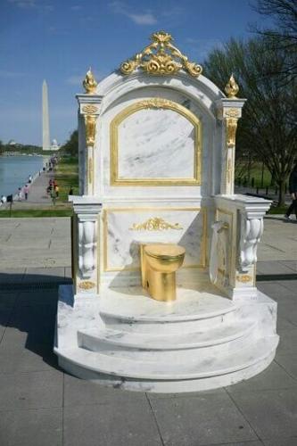 The fake golden toilet is the latest provocative installation to appear in Washington, mocking President Donald Trump