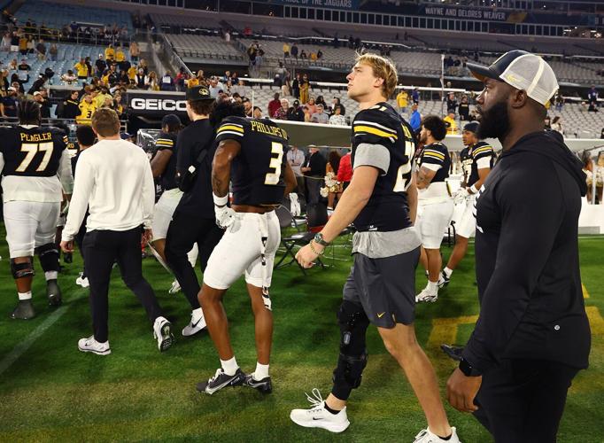 Mizzou quarterback Sam Horn walks off the field