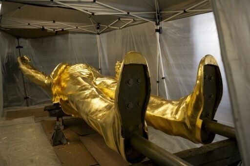 Floored: the 15-foot (4.5-metre) bronze statue coated with a thick layer of gold leaf will stand on a four-foot base