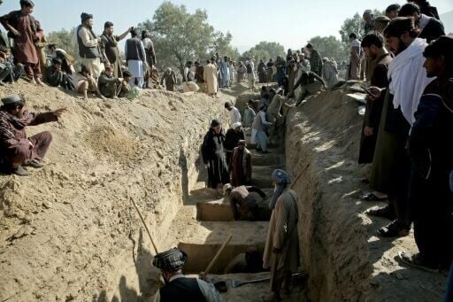 Residents in Afghanistan's Bihsud district dug a mass grave for those killed in the Pakistani strikes