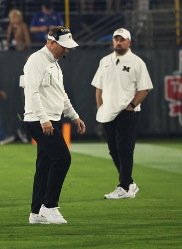 Mizzou head coach Eli Drinkwitz walks away from the huddle