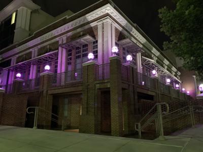 Building in Montgomery lit purple