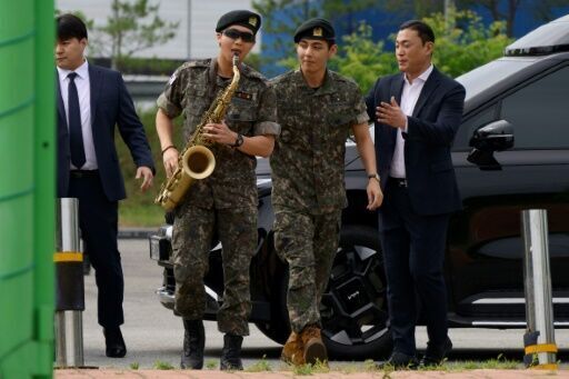 Two BTS megastars released from South Korea military