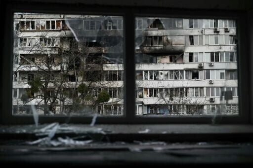 Damaged residential buildings can be seen in Kyiv after a fresh bombardment by Russia, even as negotiators work on tweaking a US-supported deal to end the war in Ukraine