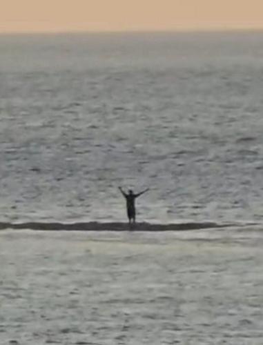Boy dressed as Batman helps save man from rising tide after spotting frantic waving