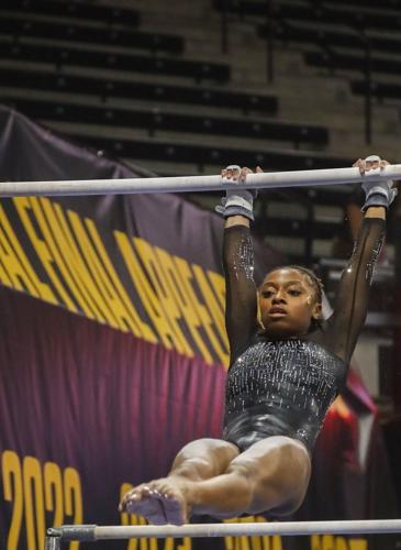 Hannah Horton performs her bar routine during Mizzou’s