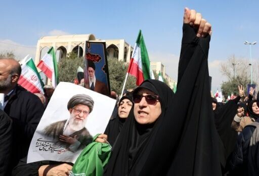 People hold portraits of Iran's slain supreme leader Ayatollah Ali Khamenei as they take part during an anti US-Israel demonstration after Friday prayer in Tehran on March 6