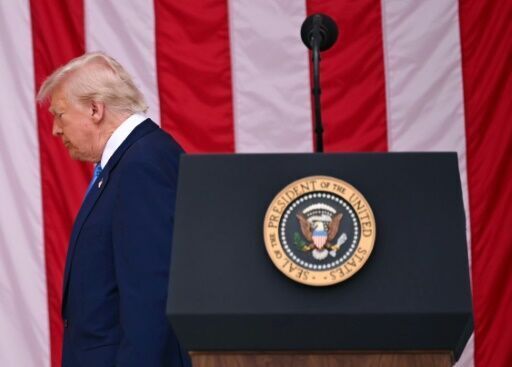 Trump attacks opponents, judges on day honoring US war dead