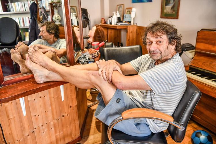 Barefoot barber stopped wearing shoes 20 years ago – even at work
