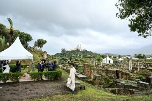 Pope Leo prays during a visit to the archaeological site of Hippo in Annaba