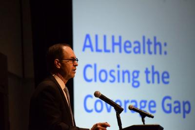 Ted Hosp, vice president of governmental relations for Blue Cross Blue Shield of Alabama, delivers a presentation on ALL Health, a proposal to extend insurance coverage in Alabama, to the Association of County Commissions of Alabama on Dec. 11, 2024 in ...