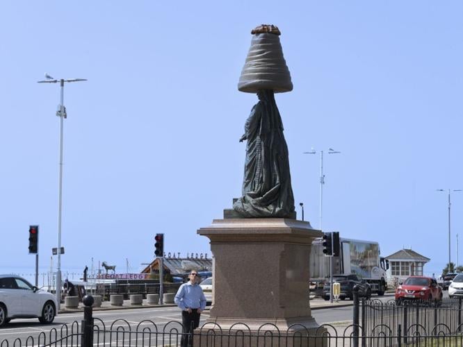 Prankster places giant Walnut Whip on statue of Queen Victoria