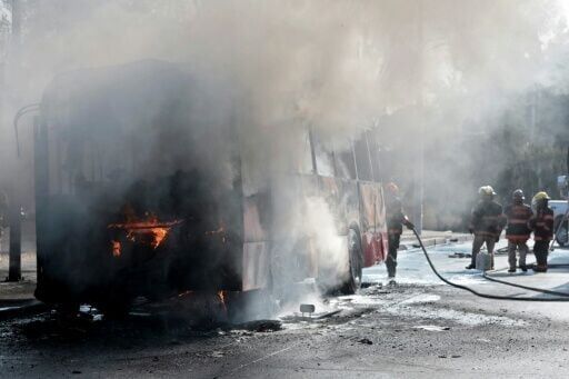 Criminals set fire to vehicles and businesses, blocked roads and attacked a prison after Mexican authorities announced the death of a major drug kingpin