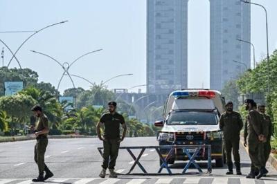 Security personnel keep watch near the expected venue of the US-Iran talks in the Red Zone area of Islamabad